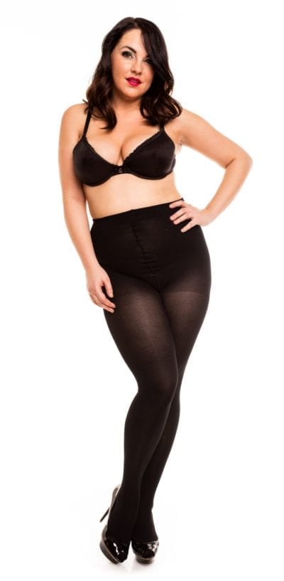 Plus size model wearing Glamory vital 70 support tights in color black front view